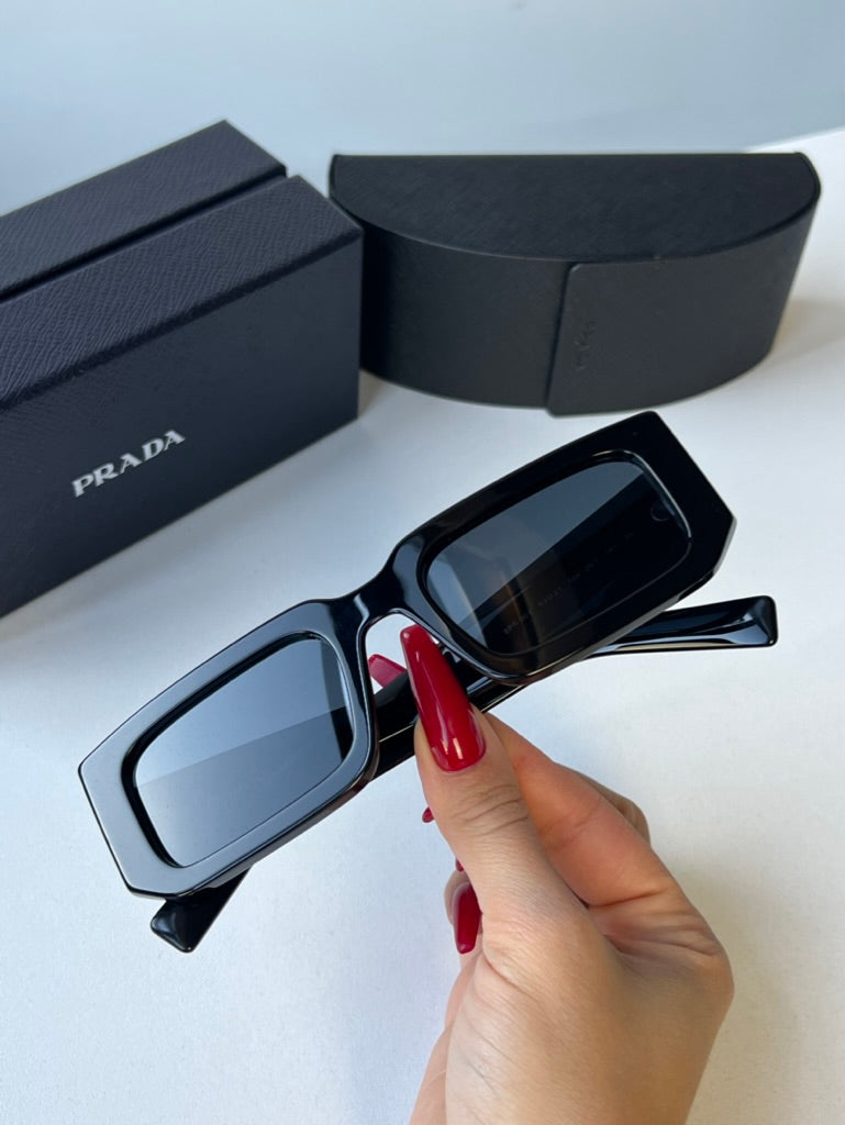 Prada PR06YS Sunglasses in Black Grey