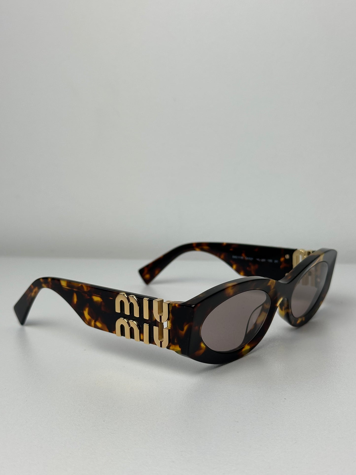 Miu Miu MU11WS Honey Havana Oval Sunglasses